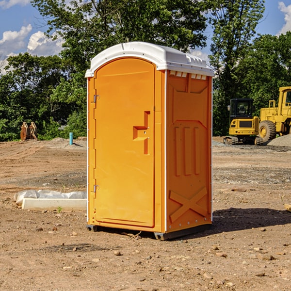 what is the cost difference between standard and deluxe portable restroom rentals in Grandy